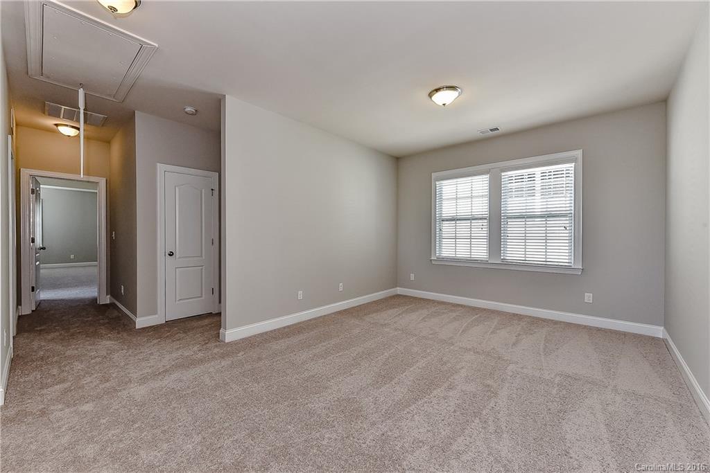5157 Waterloo Drive, Unit CC151 Tega Cay, SC 29708 - Photo 4 of 21 a view of an empty room with a window