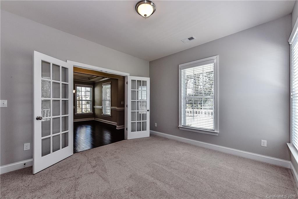 5157 Waterloo Drive, Unit CC151 Tega Cay, SC 29708 - Photo 5 of 21 an empty room with windows