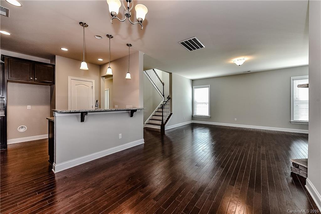5157 Waterloo Drive, Unit CC151 Tega Cay, SC 29708 - Photo 10 of 21 a view of empty room with wooden floor and fan
