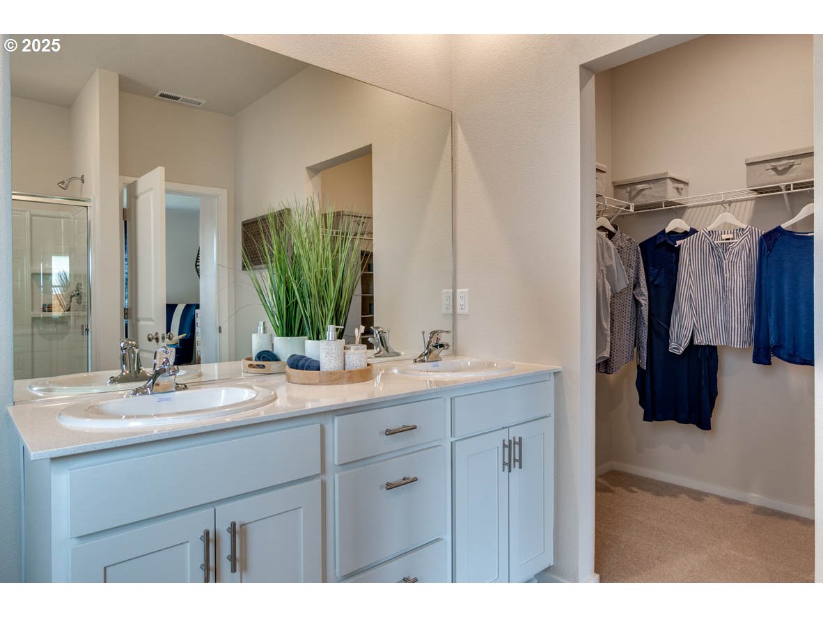 2934 U Street Springfield, OR 97477 - Photo 17 of 21 a bathroom with a double vanity sink and a mirror
