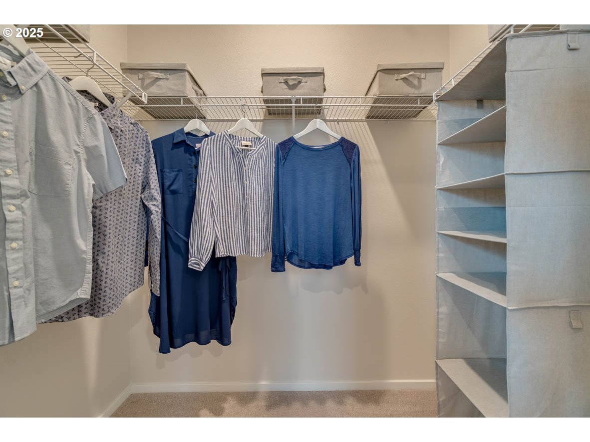 2934 U Street Springfield, OR 97477 - Photo 19 of 21 a view of walk in closet with clothes and shoes