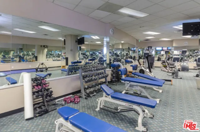 a room with lots of furniture and view of living room