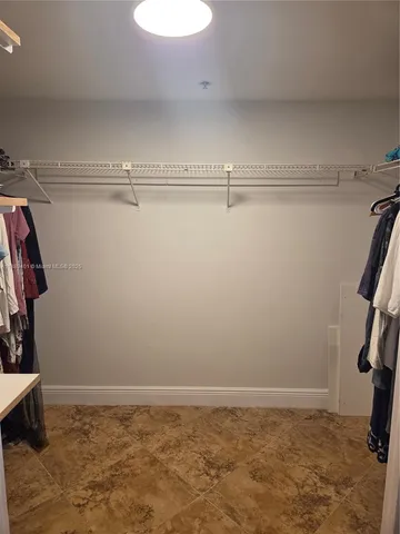 a view of a room with racks on the wall