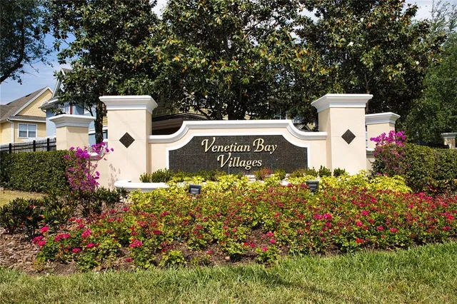 a view of a house with a yard and garden