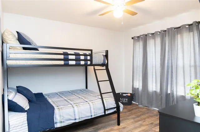 a bedroom with bed and a window