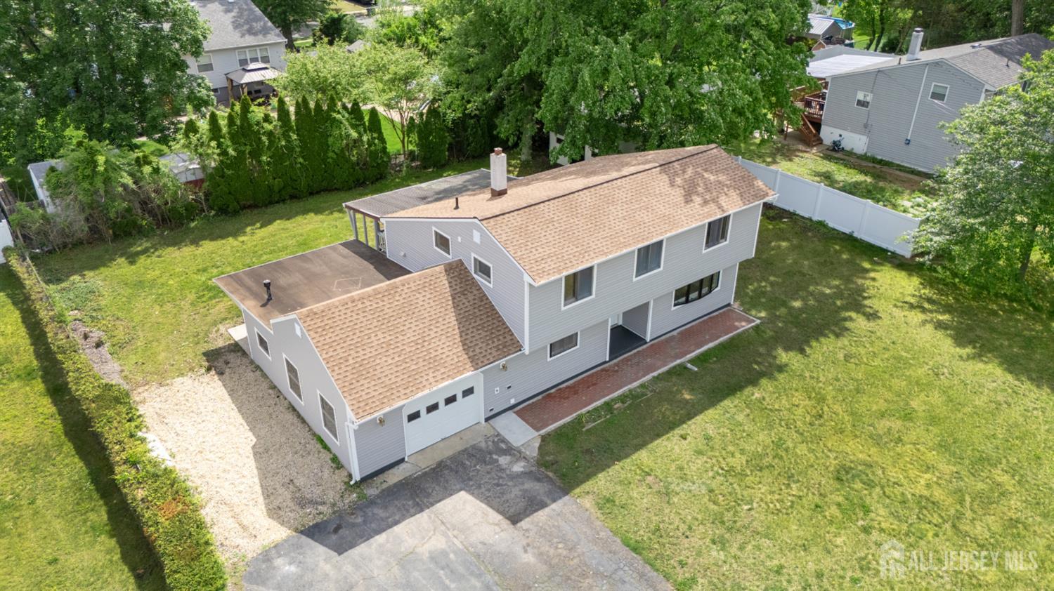 12 Daniel Road Spotswood, NJ 08884 - Photo 3 of 27 an aerial view of a house with a yard