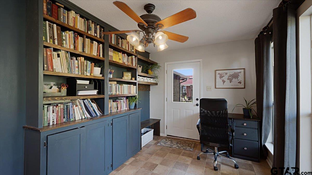 8192 County Road 428 Tyler, TX 75704 - Photo 11 of 38 a view of a workspace with bookshelf