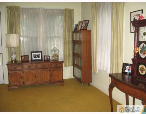306 New Market Road Dunellen, NJ 08812 - Photo 3 of 10 a living room with furniture and a window