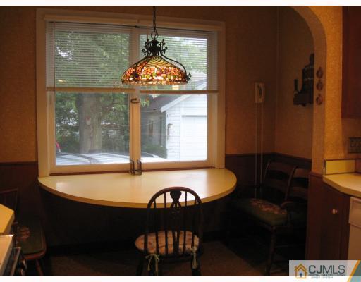 306 New Market Road Dunellen, NJ 08812 - Photo 6 of 10 a bathroom with a sink and a mirror