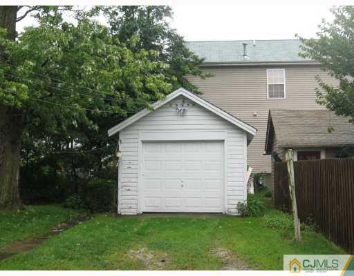 306 New Market Road Dunellen, NJ 08812 - Photo 10 of 10 a front view of a house with a yard