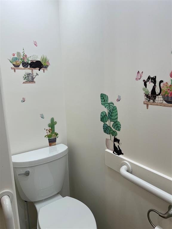 13891 Southeast 126th Boulevard, Unit 121 Okeechobee, FL 34974 - Photo 14 of 45 a white toilet sitting next to a bathroom sink