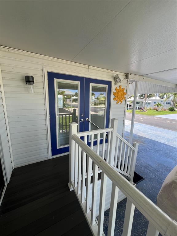 13891 Southeast 126th Boulevard, Unit 121 Okeechobee, FL 34974 - Photo 26 of 45 a view of entryway with wooden floor