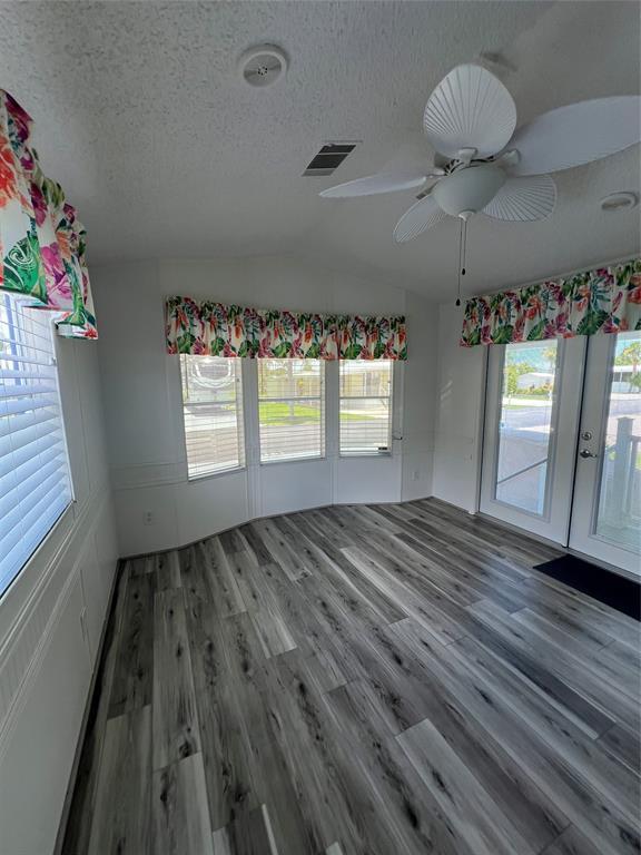 13891 Southeast 126th Boulevard, Unit 121 Okeechobee, FL 34974 - Photo 9 of 45 a view of an empty room and window