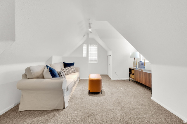 446 South 300 East Provo, UT 84606 - Photo 22 of 32 Attic bonus room featuring sloped ceilings, track lighting, and soft pile carpeting