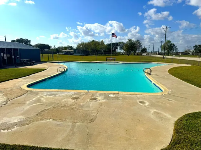a view of outdoor space swimming pool and lake view