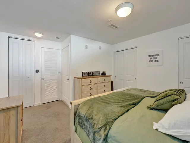 a bedroom with a bed and a cabinets