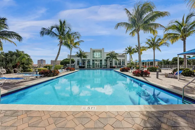 a view of swimming pool with outdoor seating