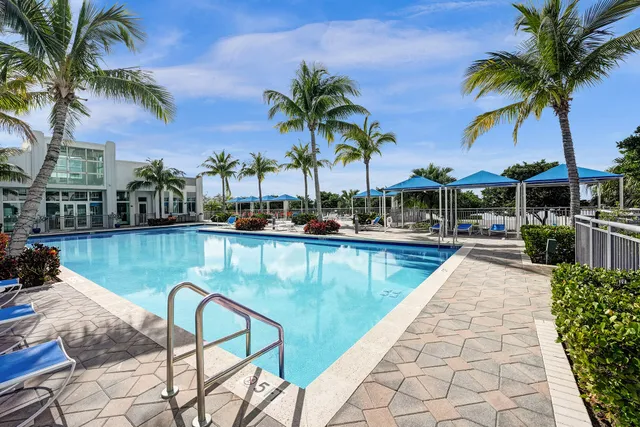 a view of swimming pool with a table and chairs