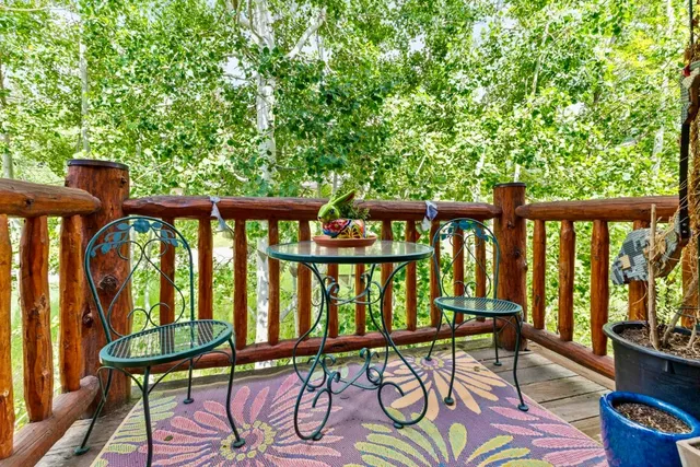 a view of a balcony with furniture