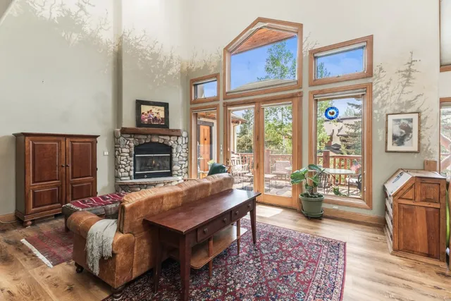 a living room with fireplace furniture and a window