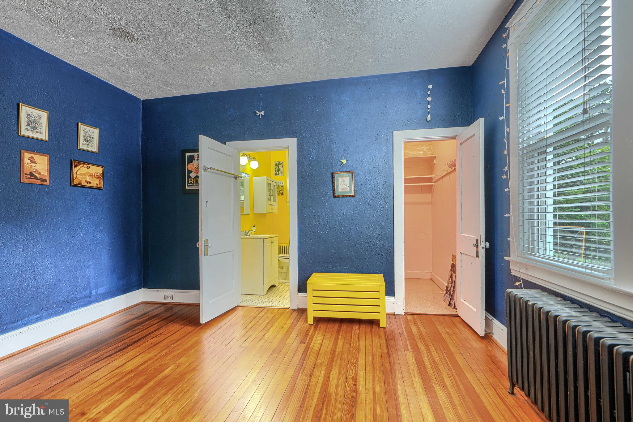 2705 Latona Road Baltimore, MD 21214 - Photo 22 of 53 a bedroom with a bed and wooden floor