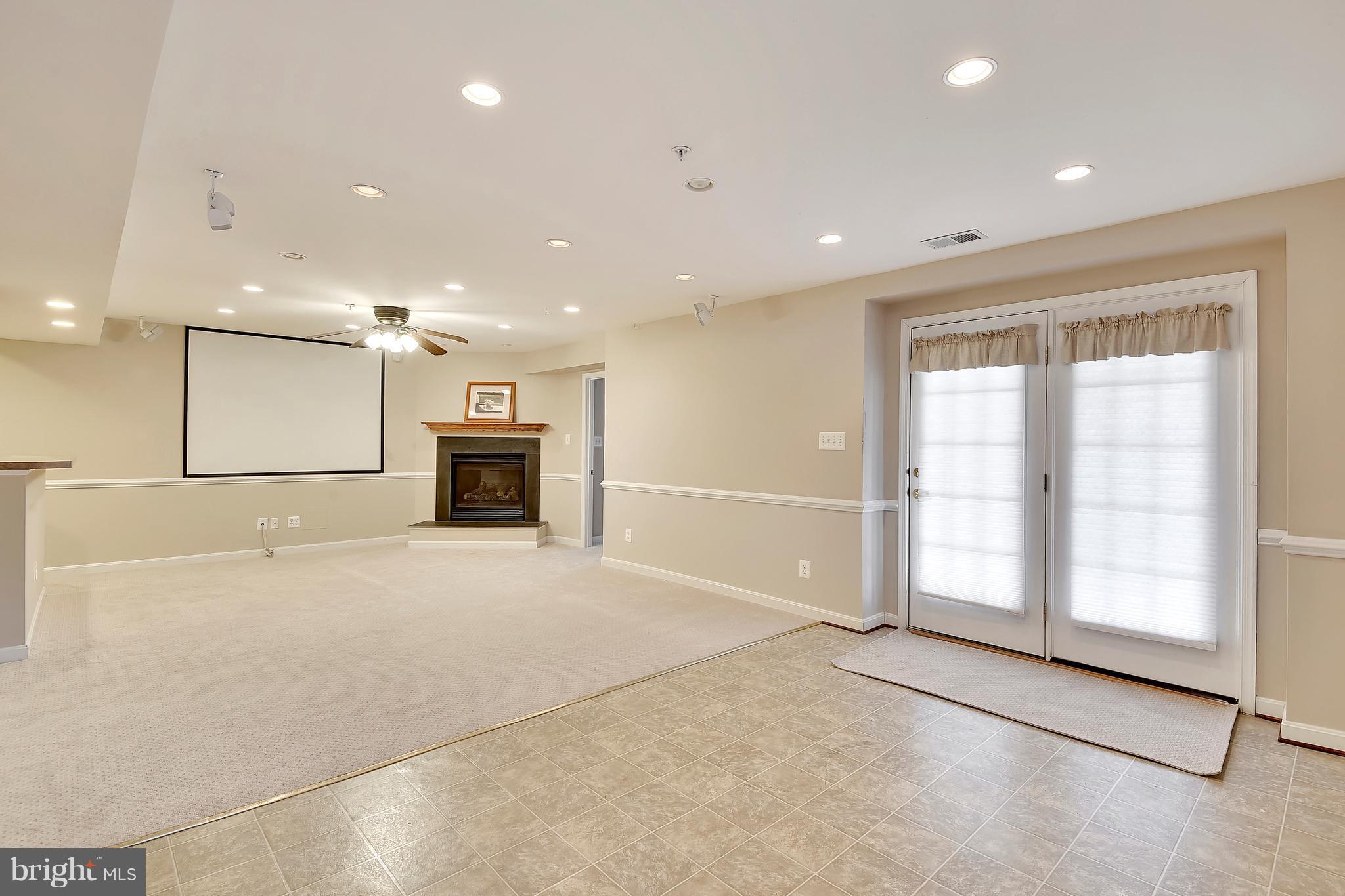 12318 Cypress Spring Road Clarksburg, MD 20871 - Photo 25 of 30 REC RM W/GAS FRPL & NEW CARPET OPENS TO PATIO