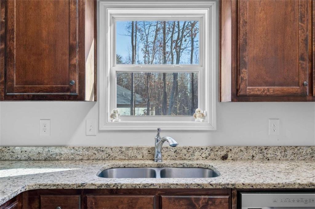 336 Dixie Ct Mount Mount Airy, GA 30563 - Photo 12 of 41 a sink with a granite countertop window