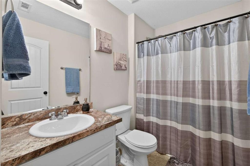 336 Dixie Ct Mount Mount Airy, GA 30563 - Photo 25 of 41 a bathroom with a granite countertop sink and a mirror