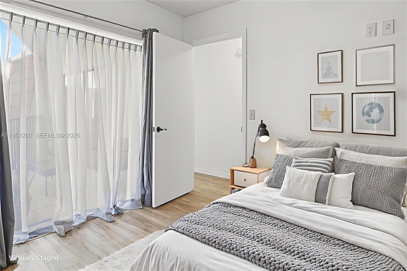 23024 Oxford Place, Unit C Boca Raton, FL 33433 - Photo 11 of 22 a bedroom with a bed and a window