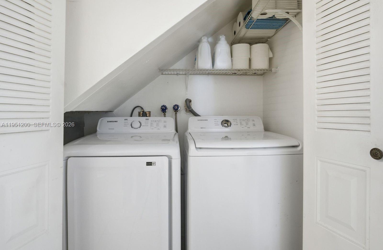23024 Oxford Place, Unit C Boca Raton, FL 33433 - Photo 15 of 22 a utility room with dryer and washer