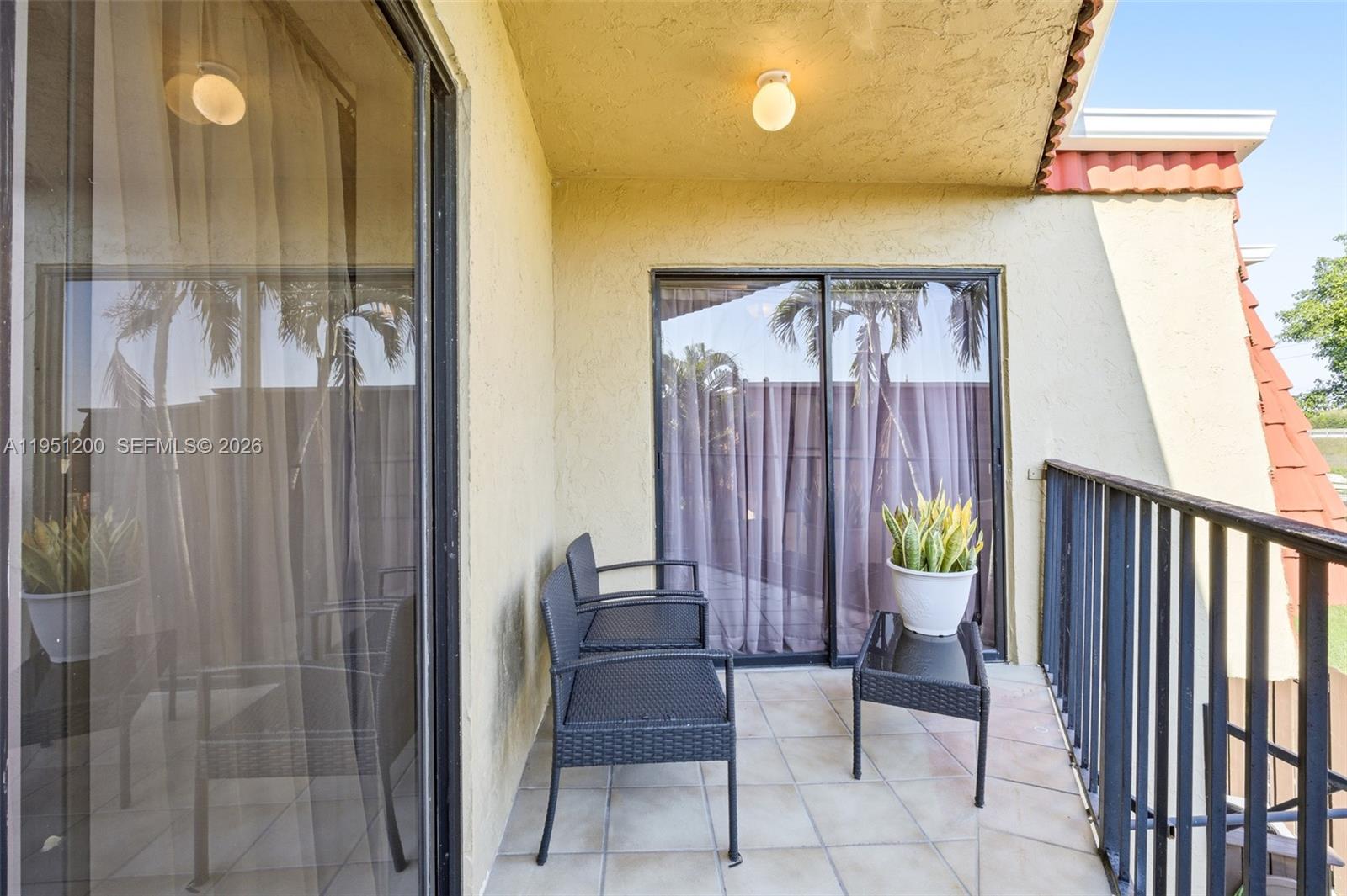 23024 Oxford Place, Unit C Boca Raton, FL 33433 - Photo 17 of 22 a view of a hallway with wooden floor and chair