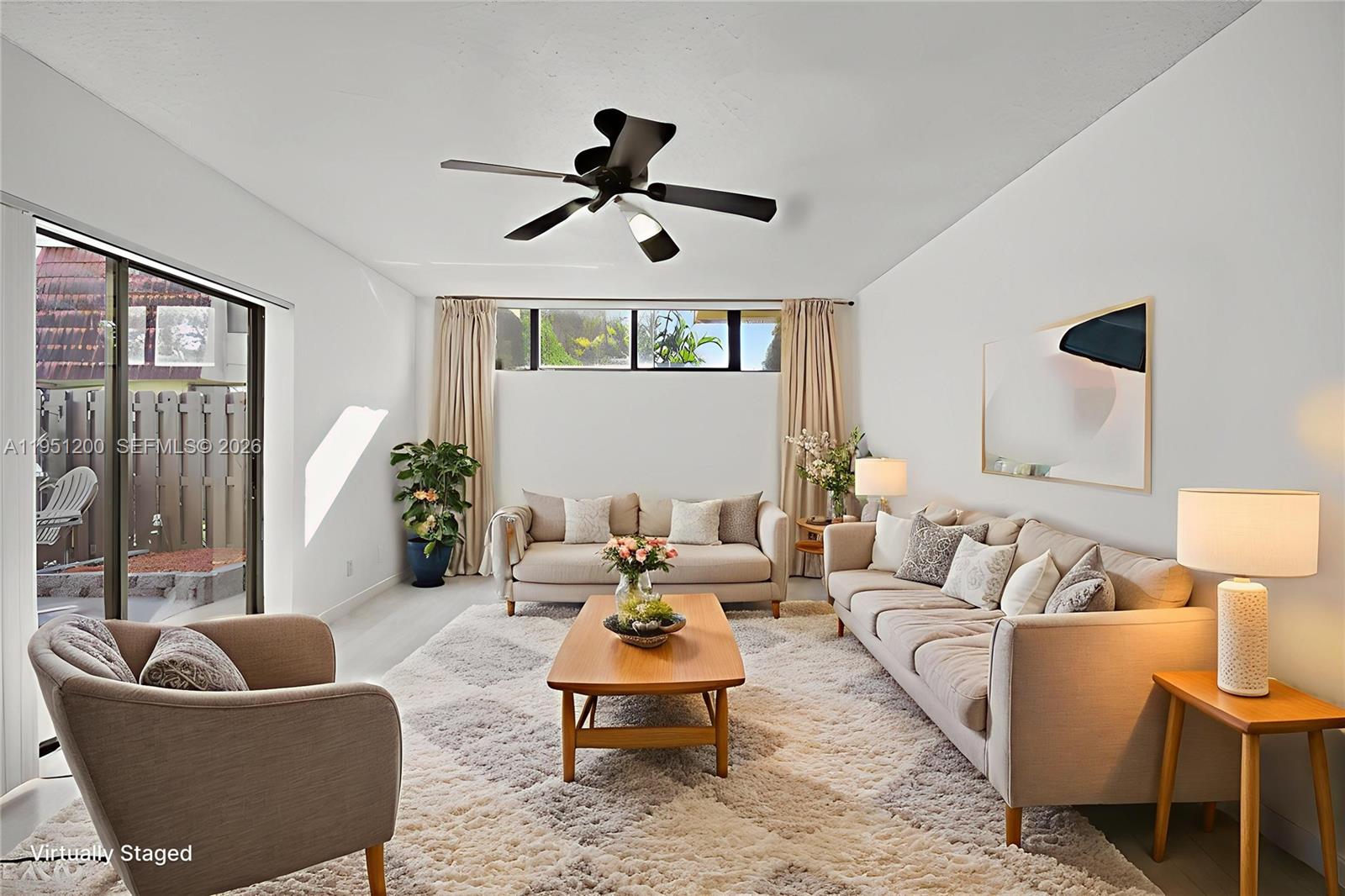 23024 Oxford Place, Unit C Boca Raton, FL 33433 - Photo 2 of 22 a living room with furniture and a large window