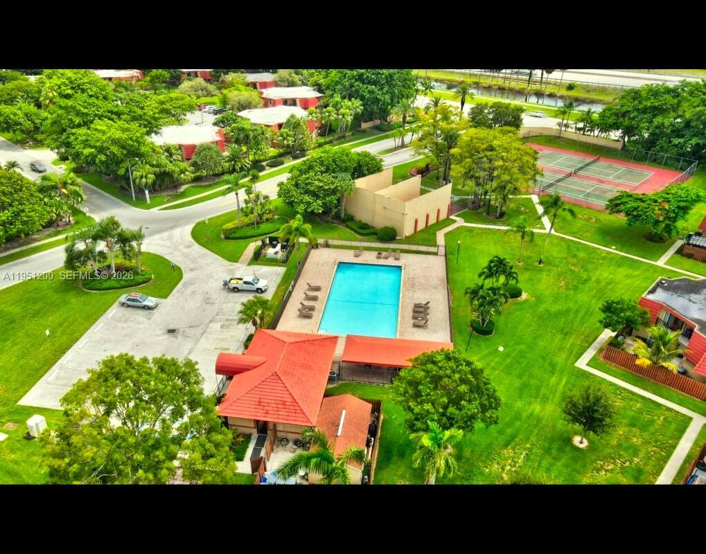 23024 Oxford Place, Unit C Boca Raton, FL 33433 - Photo 22 of 22 a view of a house with a garden