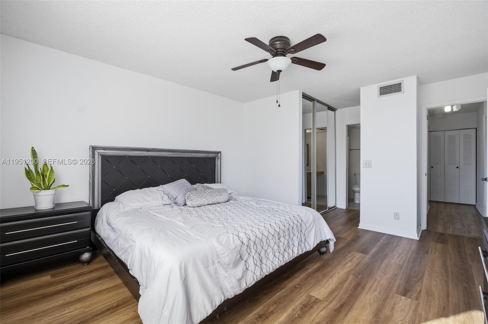 23024 Oxford Place, Unit C Boca Raton, FL 33433 - Photo 7 of 22 a bedroom with a bed and a window