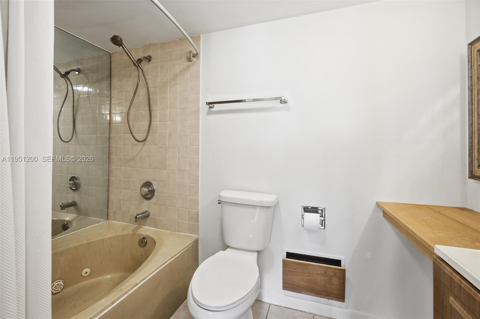 23024 Oxford Place, Unit C Boca Raton, FL 33433 - Photo 10 of 22 a white toilet sitting next to a bath tub and a shower