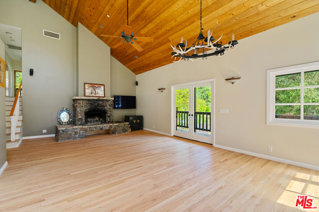 20912 Fontaine Road Topanga, CA 90290 - Photo 8 of 52 a view of a livingroom with furniture a flat screen tv and window