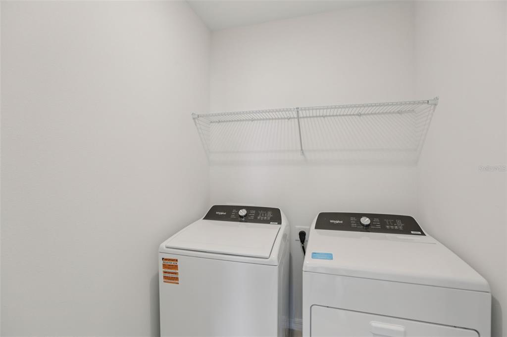 643 Pennywort Street Lake Alfred, FL 33850 - Photo 19 of 47 a utility room with dryer and washer