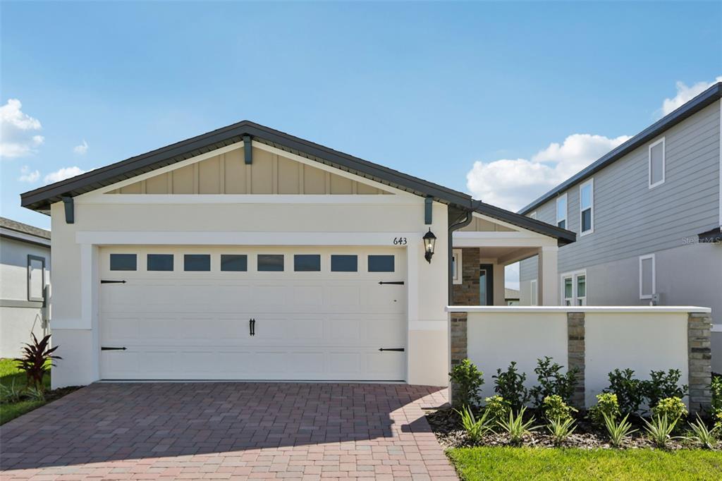 643 Pennywort Street Lake Alfred, FL 33850 - Photo 2 of 47 a front view of a house with a yard