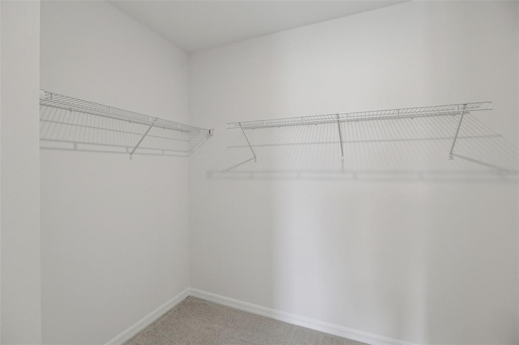 643 Pennywort Street Lake Alfred, FL 33850 - Photo 25 of 47 a view of a room with racks on the wall