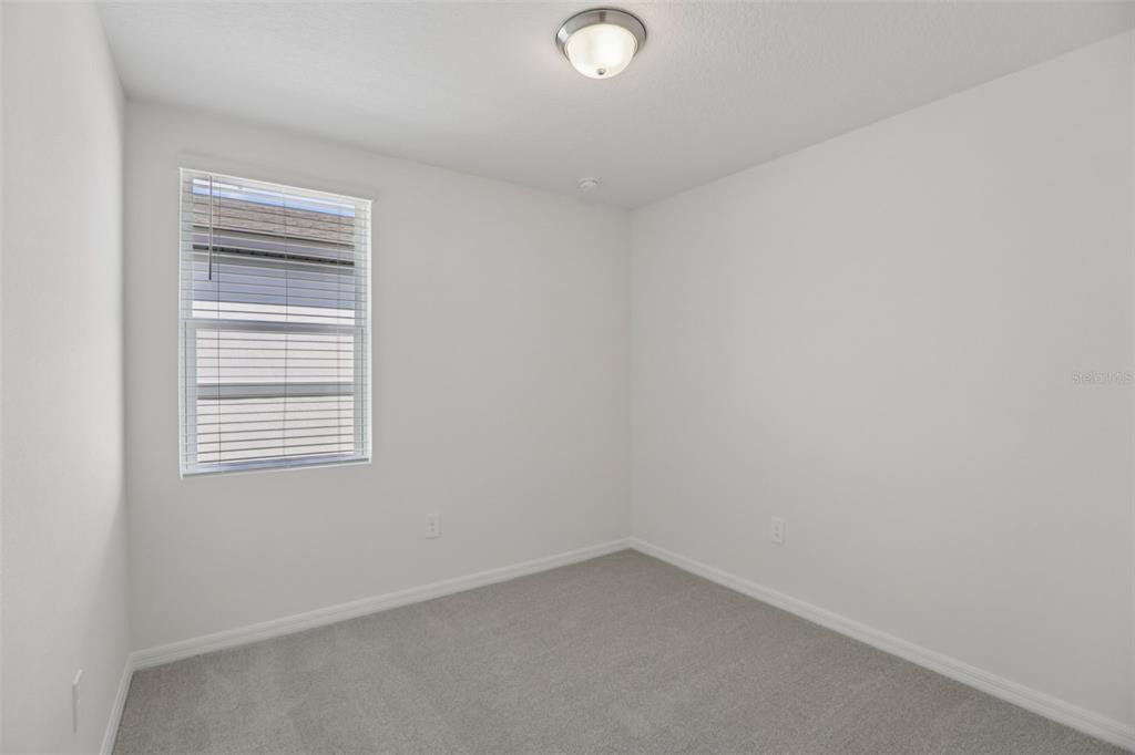 643 Pennywort Street Lake Alfred, FL 33850 - Photo 27 of 47 a view of an empty room with a window