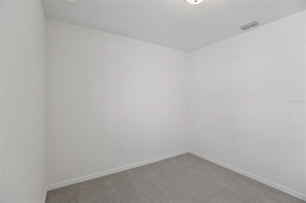 643 Pennywort Street Lake Alfred, FL 33850 - Photo 30 of 47 a room that has a white wall