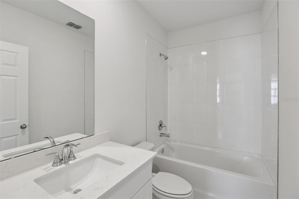 643 Pennywort Street Lake Alfred, FL 33850 - Photo 31 of 47 a bathroom with a sink toilet and shower