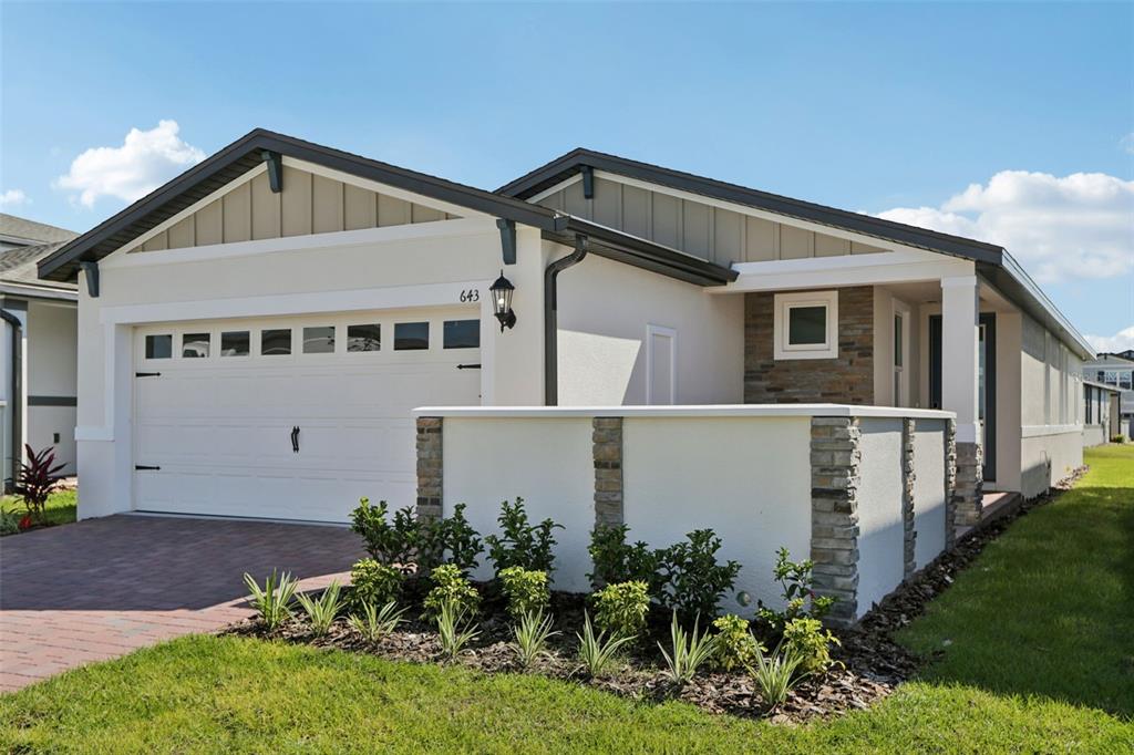 643 Pennywort Street Lake Alfred, FL 33850 - Photo 4 of 47 a front view of a house with a yard