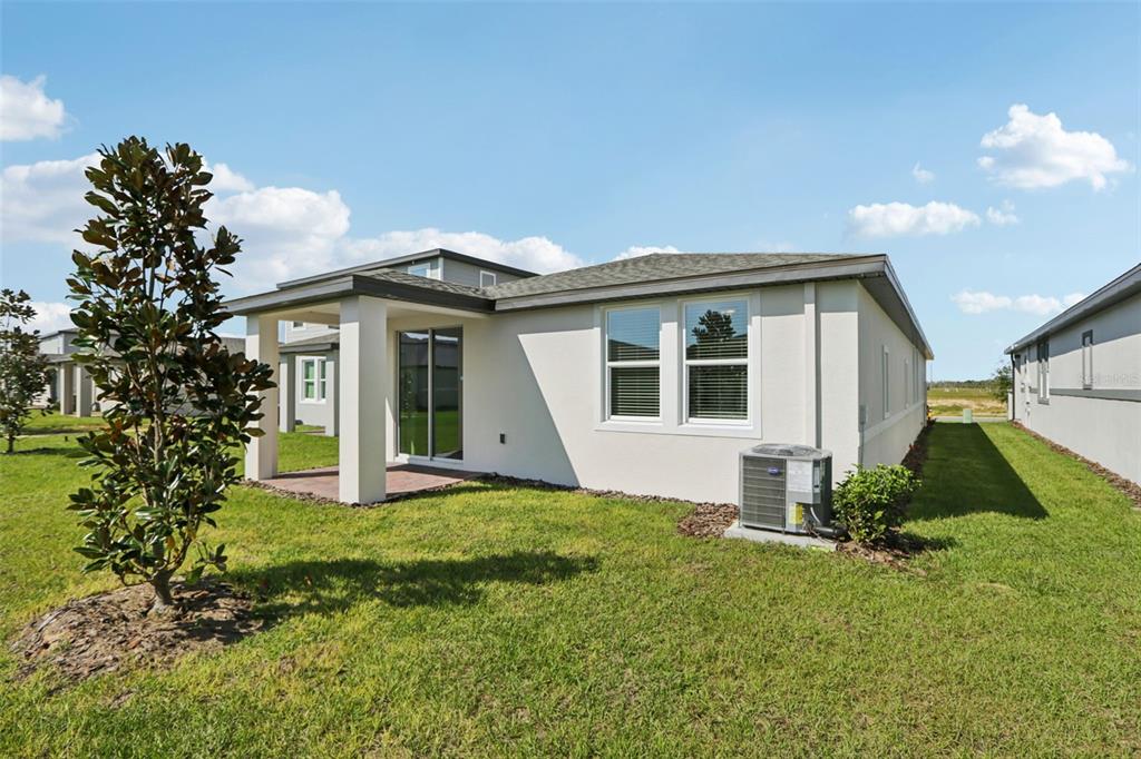 643 Pennywort Street Lake Alfred, FL 33850 - Photo 46 of 47 a view of a house with a yard