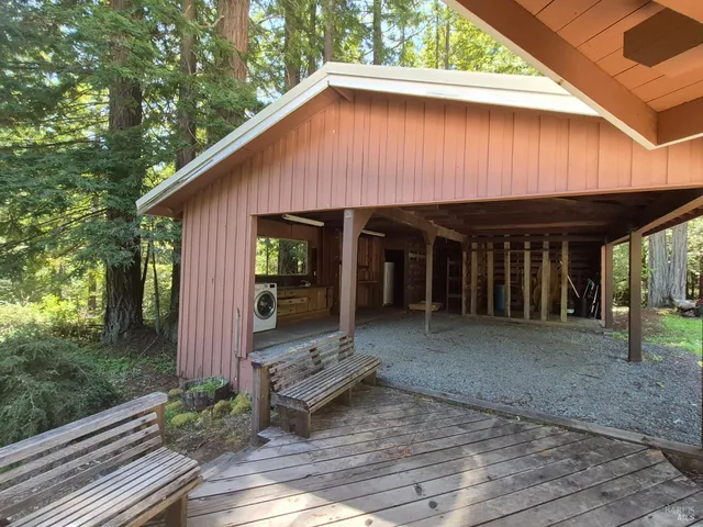a view of a house with backyard space and porch