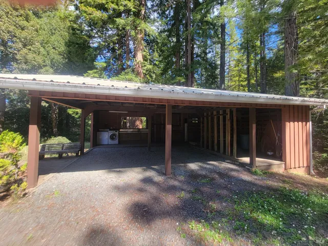 a view of balcony with wooden floor and fence