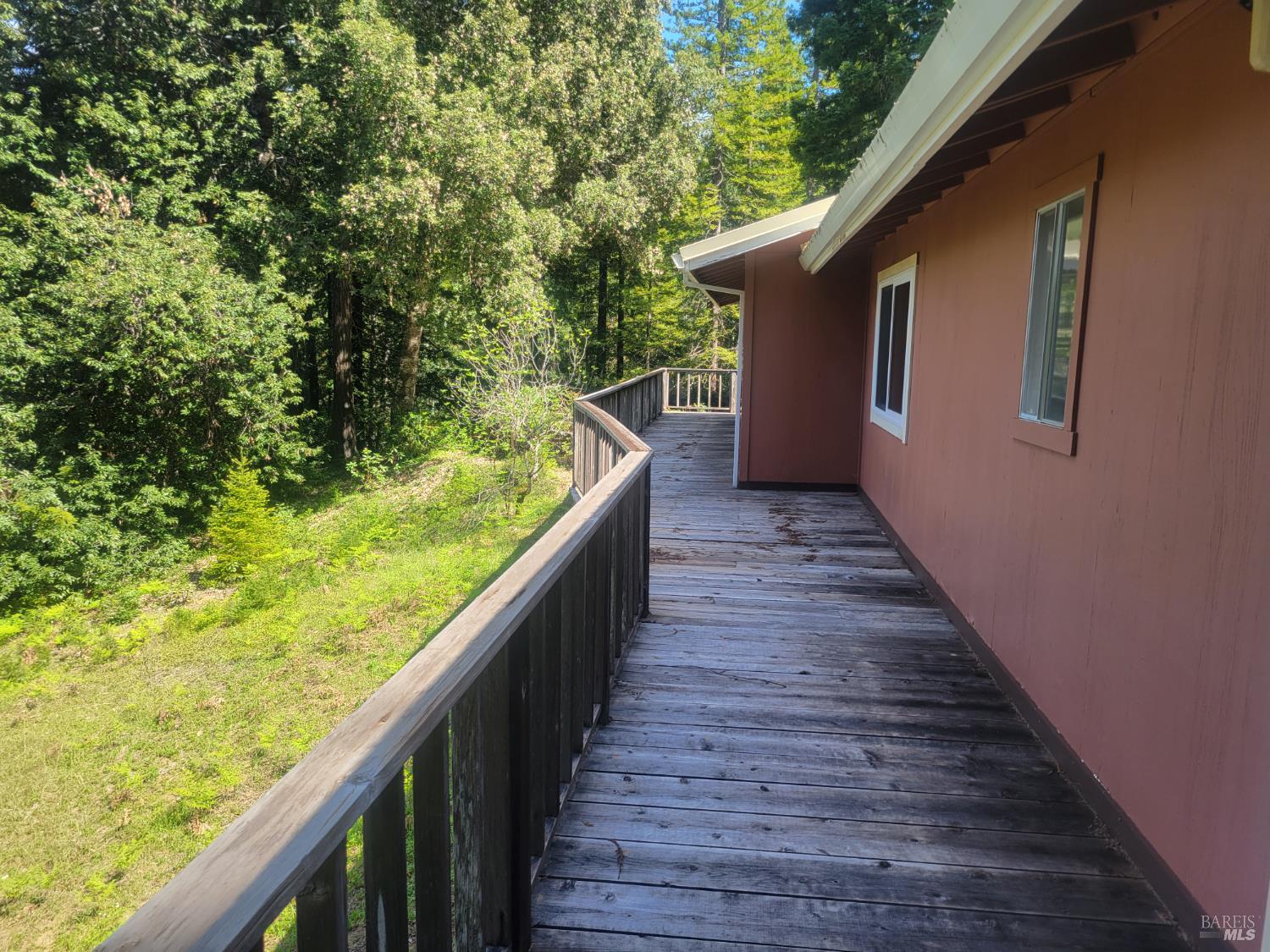 11903 Branscomb Road Laytonville, CA 95454 - Photo 18 of 72 a view of balcony with wooden floor and fence