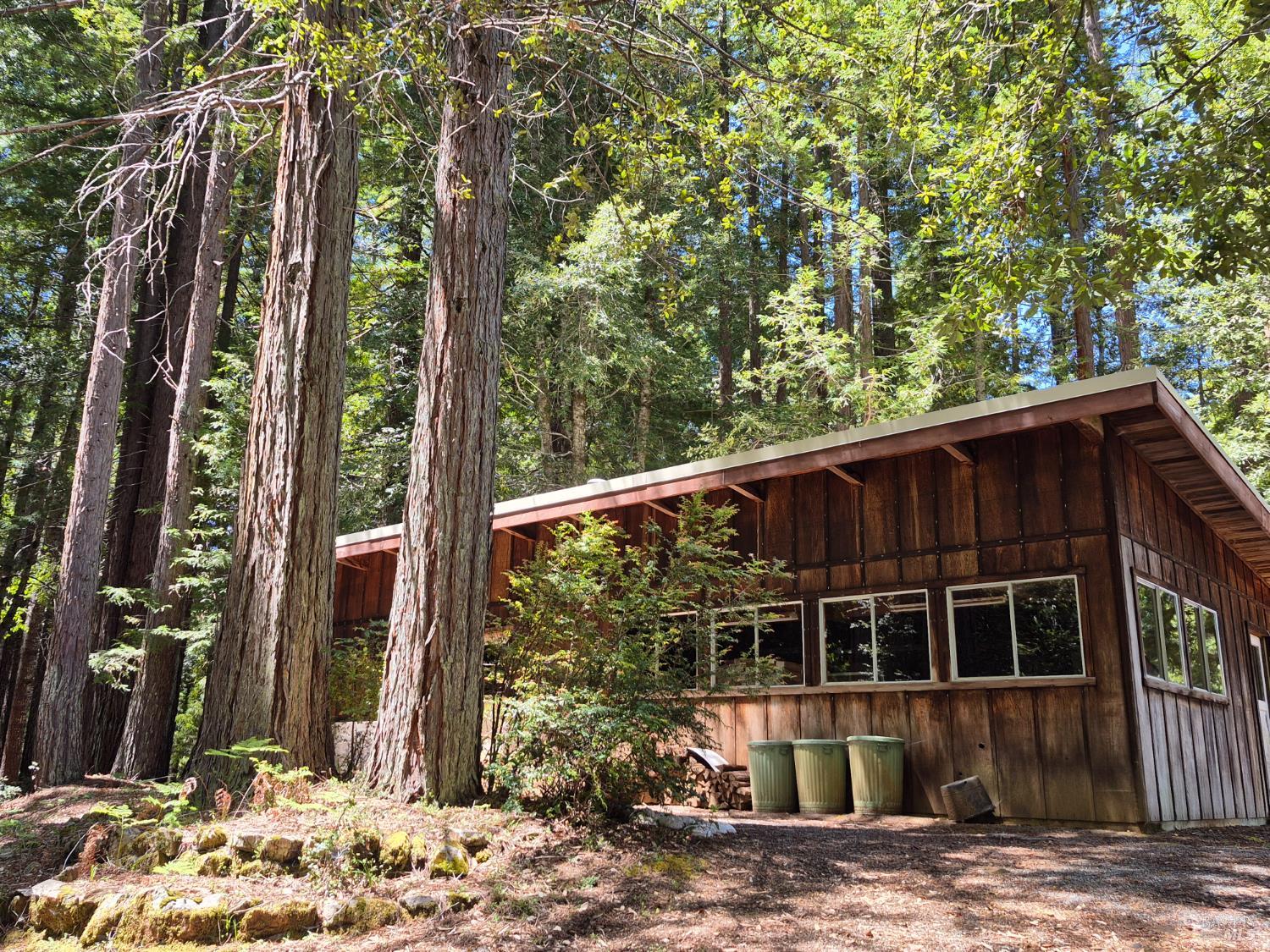 11903 Branscomb Road Laytonville, CA 95454 - Photo 28 of 72 a front view of a house with a yard