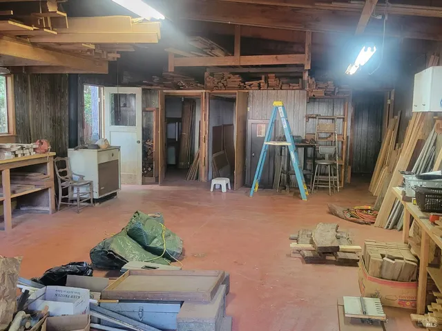 a backyard of a house with yard and outdoor seating