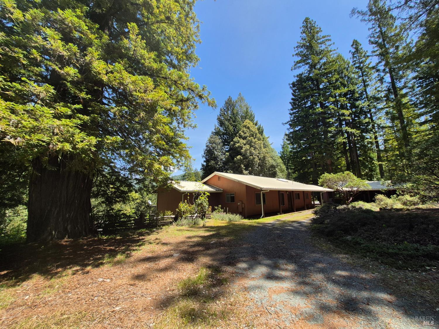 11903 Branscomb Road Laytonville, CA 95454 - Photo 43 of 72 a view of a house with a yard